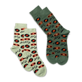 Two pairs of crew socks: one light green and one darker green, both featuring a music record and boombox pattern.