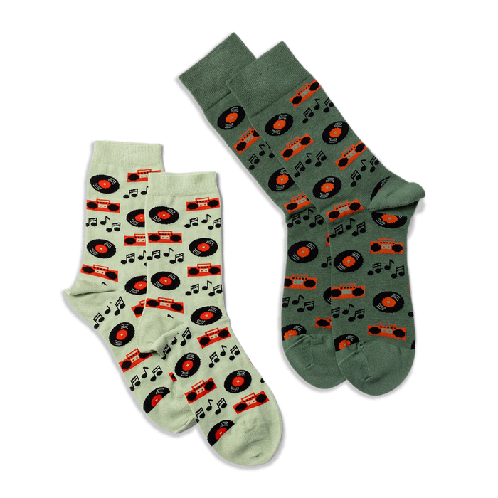 Two pairs of crew socks: one light green and one darker green, both featuring a music record and boombox pattern.