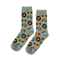 Pair of light green crew socks with a repeating pattern of orange boomboxes, black vinyl records, and music notes.