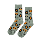 Pair of light green crew socks with a repeating pattern of orange boomboxes, black vinyl records, and music notes.
