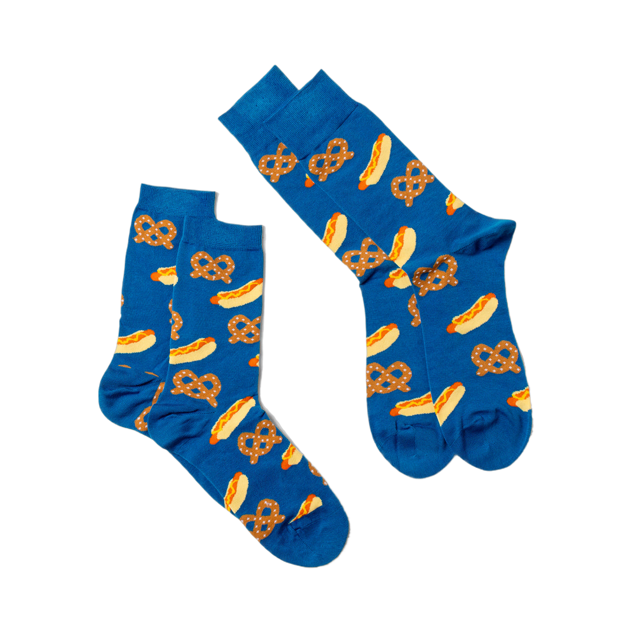 Two blue crew socks with hot dog and pretzel pattern, laid flat and angled on a white surface, one slightly overlapping.