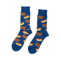 Pair of blue crew socks with a repeating pattern of yellow hot dogs with red sausages and mustard, and brown pretzels.