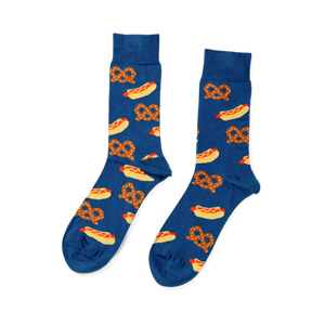 Pair of blue crew socks with a repeating pattern of yellow hot dogs with red sausages and mustard, and brown pretzels.