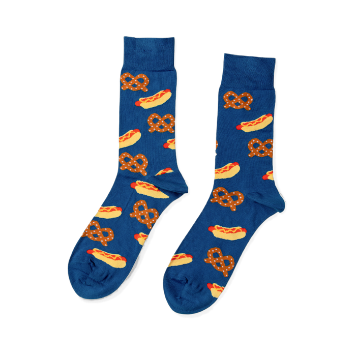 Pair of blue crew socks with a repeating pattern of yellow hot dogs with red sausages and mustard, and brown pretzels.
