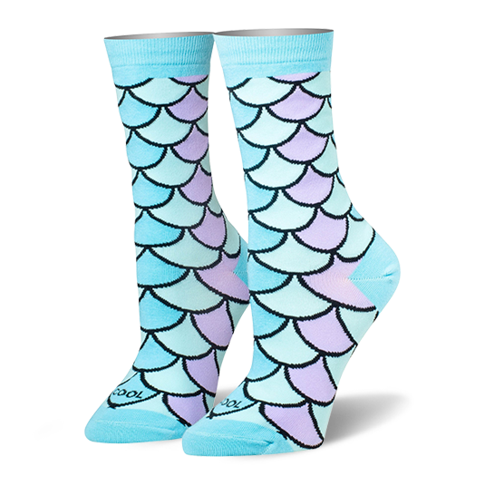 Crew socks featuring a mermaid scale pattern in pastel blue, teal, and lilac with black outlines and solid light blue cuffs. }}