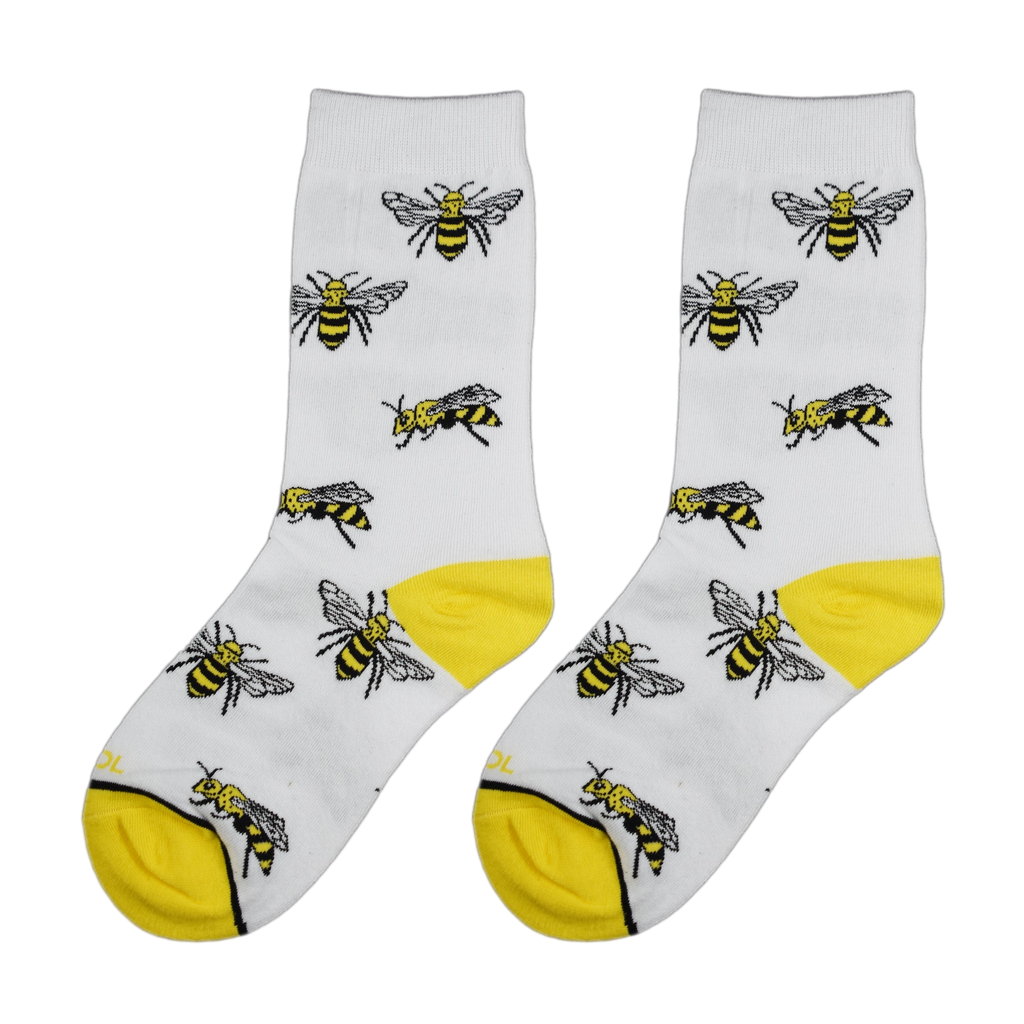 Close-up view of a pair of white socks with yellow bee illustrations.