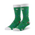 Pair of green crew socks with a fun golf-themed pattern. Features golf balls, clubs, tees, and flags in red, blue, and black.