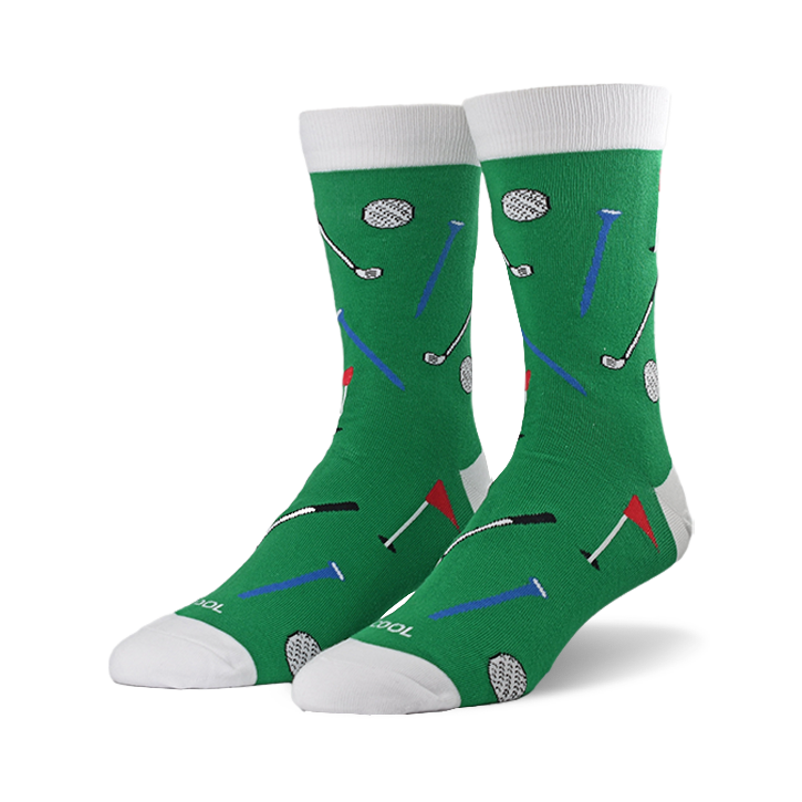 Pair of green crew socks with a fun golf-themed pattern. Features golf balls, clubs, tees, and flags in red, blue, and black.