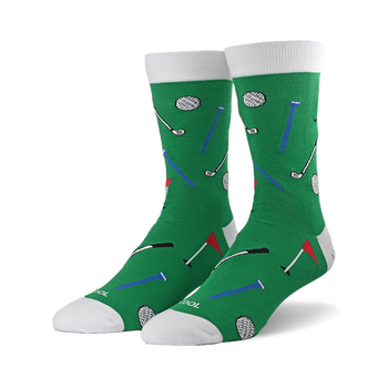 A pair of green socks with a golf pattern, showing white golf balls, black and silver clubs, red flags, and blue tees.