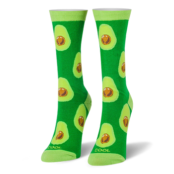 Bright green crew socks covered in halved avocados with brown pits, featuring light lime green cuffs and toes.