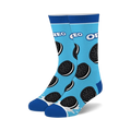 Pair of crew socks on light blue background, adorned with Oreo cookies and a milk splash at the bottom. Black and white Oreo design.