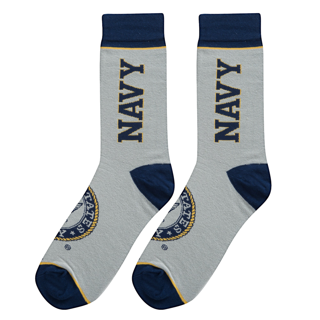 Flatlay showcasing a pair of grey US Navy socks with navy blue cuffs and emblem details.