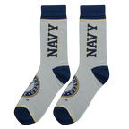 Flatlay showcasing a pair of grey US Navy socks with navy blue cuffs and emblem details.