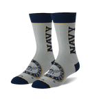 Pair of grey crew socks with navy blue accents. Features a navy 'NAVY' wordmark and US Navy emblem.