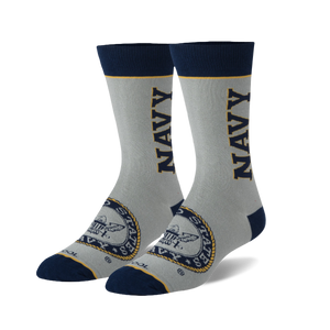 Pair of grey crew socks with navy blue accents. Features a navy 'NAVY' wordmark and US Navy emblem.