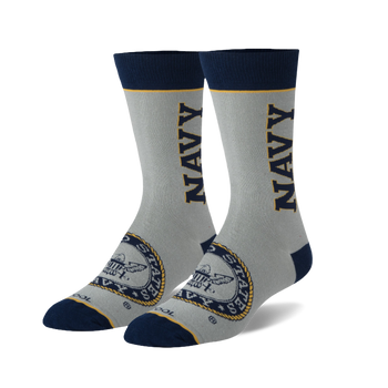 Pair of grey crew socks with navy blue accents. Features a navy 'NAVY' wordmark and US Navy emblem.