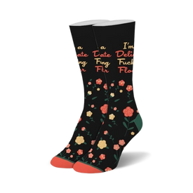 black crew socks with multicolored flowers and the bold statement "i'm a delicate fucking flower."  