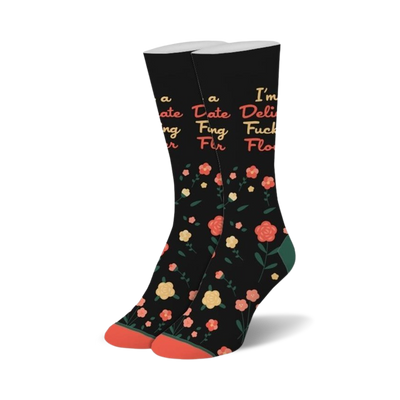 black crew socks with multicolored flowers and the bold statement "i'm a delicate fucking flower."  