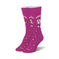 Pair of magenta crew socks with a whimsical unicorn design, gold stars, and the text 'Namastay In Bed'.