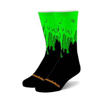 black crew socks featuring a green slime dripping pattern. for men and women.   