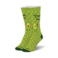 Pair of crew socks in green with yellow polka dots.  Features illustrations of avocados making a toast, with one holding a glass of wine.