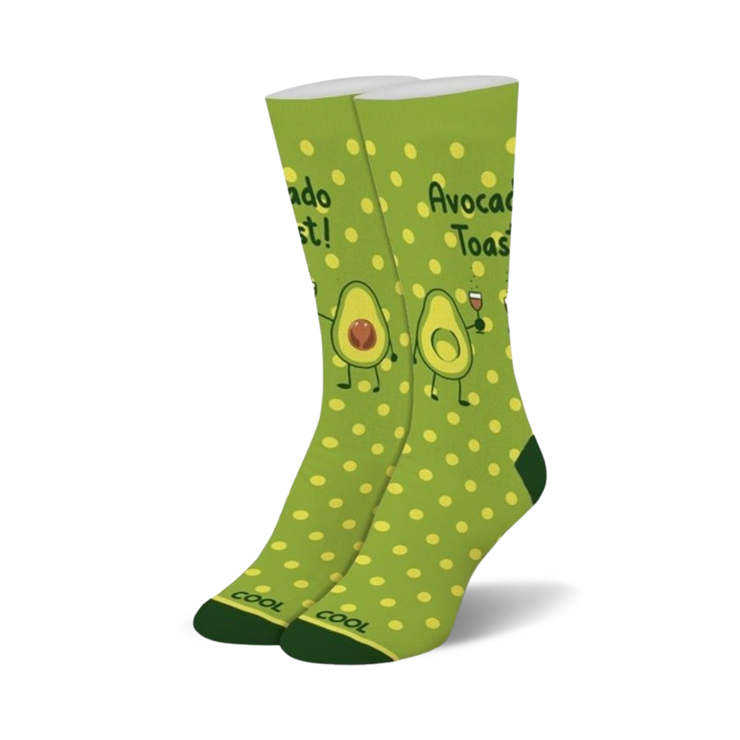 Pair of crew socks in green with yellow polka dots.  Features illustrations of avocados making a toast, with one holding a glass of wine.