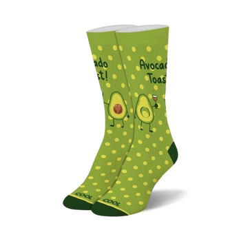 womens crew socks with bright green polka dots and friendly avocado cartoons. avocado toast is written on top of each sock and one avocado holds a glass of red wine.  