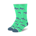 Pair of teal crew socks with a pattern of gray sharks and white bubbles. 