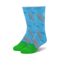 Crew socks in light blue with a repeating pattern of gray manatees swimming amongst bubbles and small fish. Green cuffs complete the design.