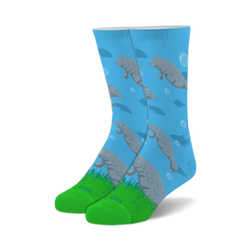 blue crew socks for men and women showcasing manatees swimming amongst green hills.   