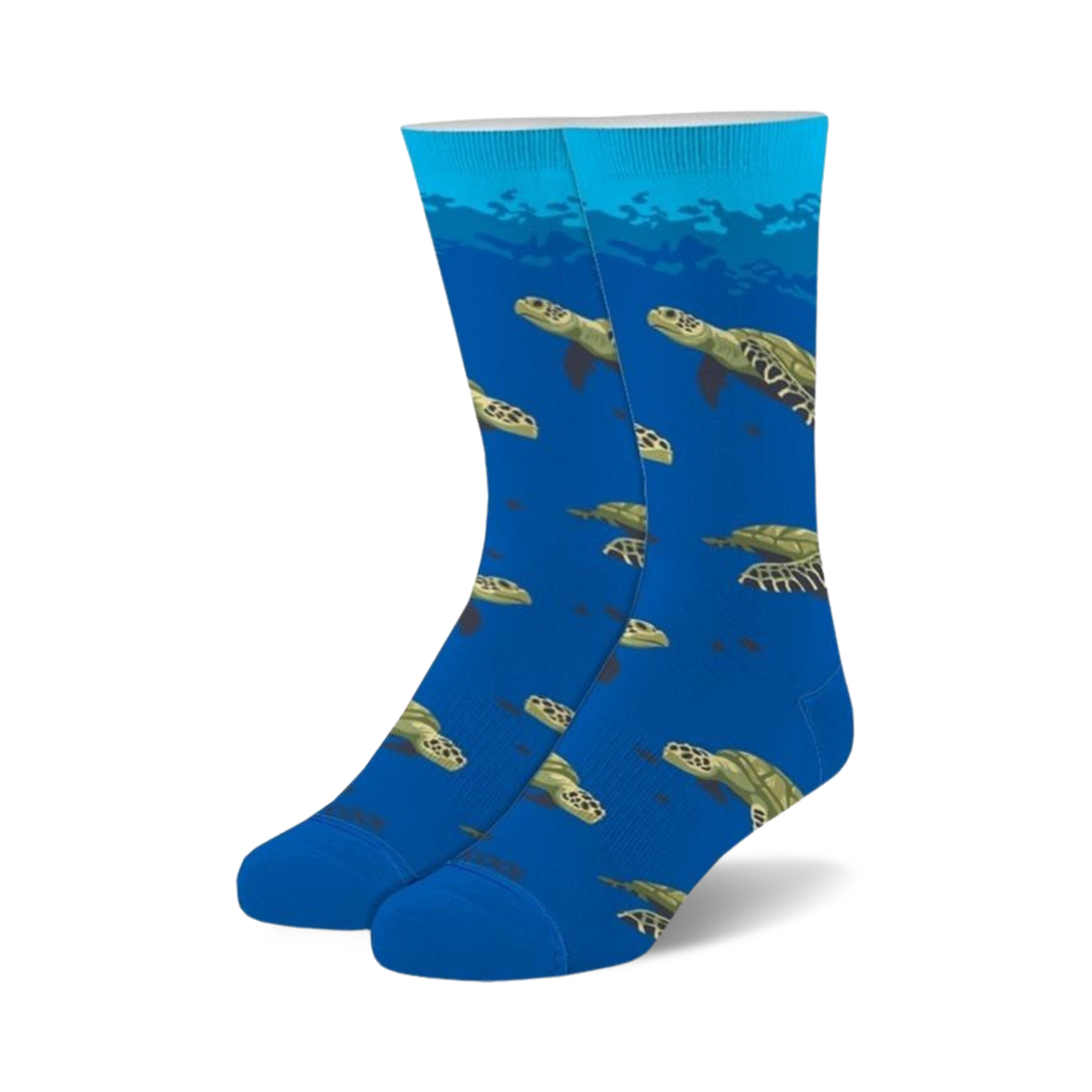 Pair of blue crew socks with a repeating pattern of sea turtles swimming underwater. Green and brown turtles on a bright blue background.