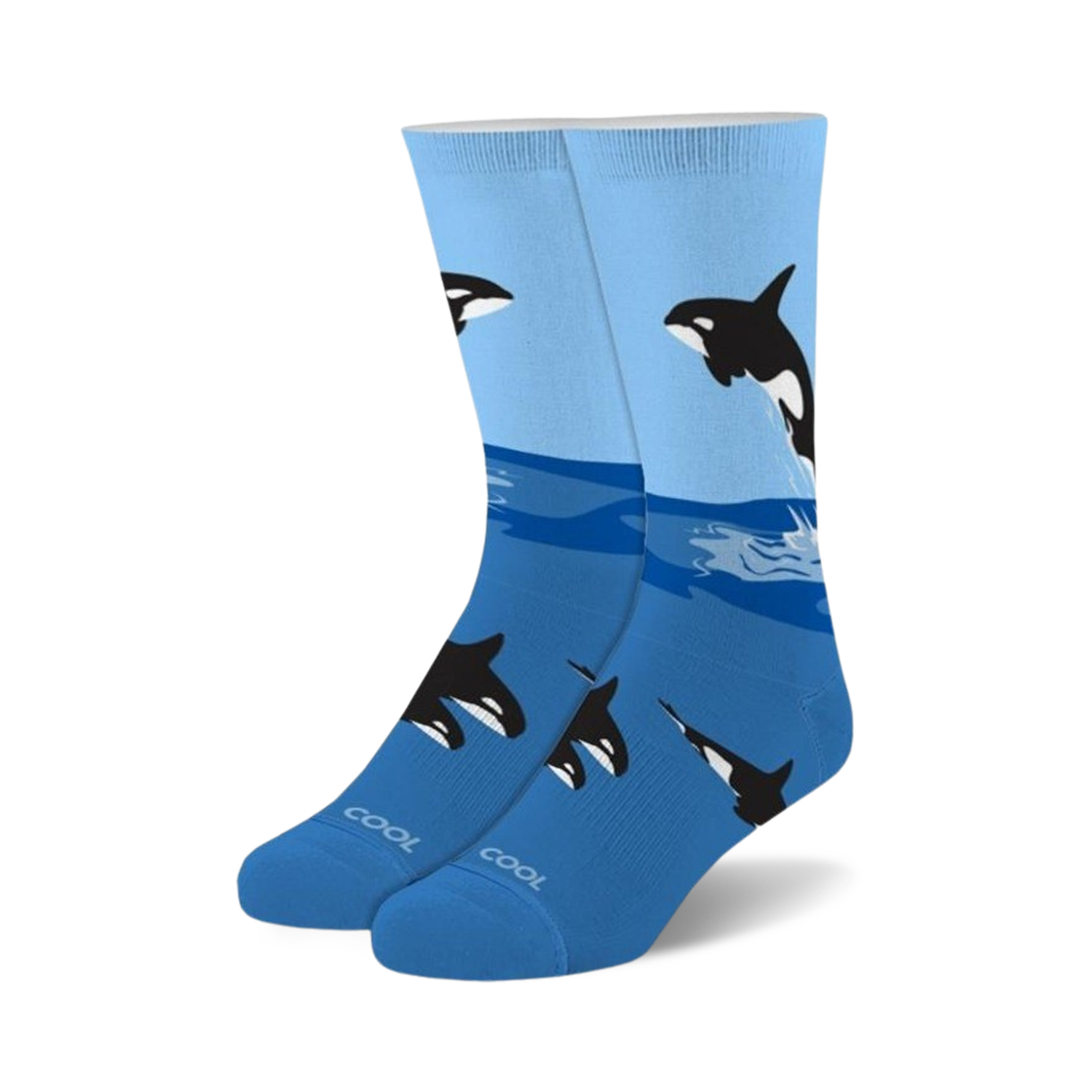 A pair of blue crew socks with a playful design featuring black and white orcas leaping from the ocean waves.