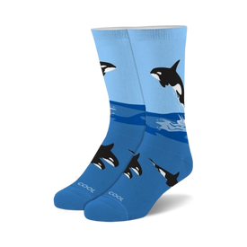 crew-length "free willy" socks feature a pattern of orcas jumping from ocean waves. made for men and women.   