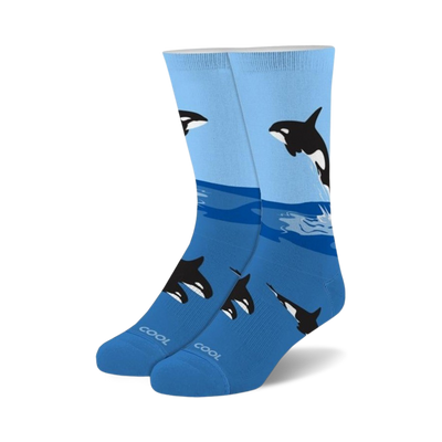 crew-length "free willy" socks feature a pattern of orcas jumping from ocean waves. made for men and women.   