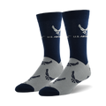 Pair of navy blue and grey crew socks. The socks feature a repeating pattern of the US Air Force emblem on a grey background and a larger emblem on the navy blue top section.
