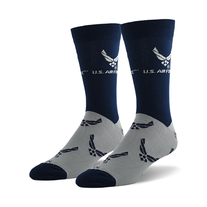 Pair of navy blue and grey crew socks. The socks feature a repeating pattern of the US Air Force emblem on a grey background and a larger emblem on the navy blue top section.