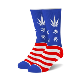 men's and women's blue crew socks with legalize it motif have a white stripe at the top, red and white stripes at the bottom, and white cannabis leaves on a blue background.   