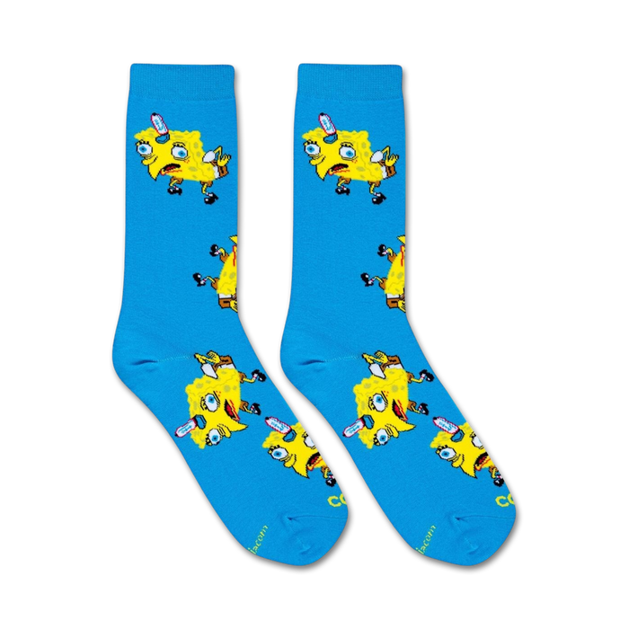 A pair of blue socks with a pattern of two cartoon characters. The characters are yellow and have large eyes. They are both making silly faces.