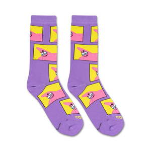 A close up of a pair of purple socks with a repeating pattern of Patrick Star from Spongebob Squarepants. Patrick is pink and has a goofy expression on his face. The socks are made of a soft, stretchy material.