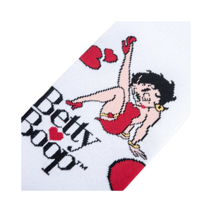 Lifestyle shot showing the socks on a person's feet. They're white with a Betty Boop design, highlighting how they look when worn.