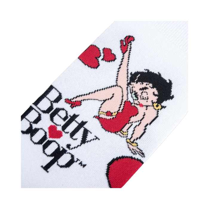 Lifestyle shot showing the socks on a person's feet. They're white with a Betty Boop design, highlighting how they look when worn.