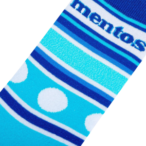 A blue sock with white polka dots and blue and white stripes with the word 