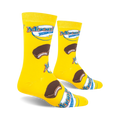 Lifestyle shot of two MoonPie socks on a black background.