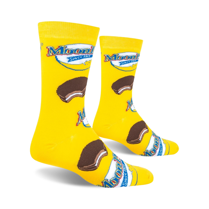A pair of yellow socks with a design of a chocolate sandwich cookie on each sock.