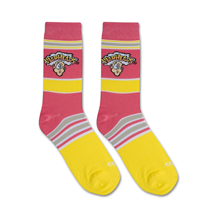 A pink sock with yellow and white stripes features the Warheads logo in a cloud with a cartoon character.