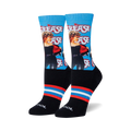 Crew socks featuring Sandy from Grease. Blue background with red and white stripes at the cuff.  Image shows the socks from the front.