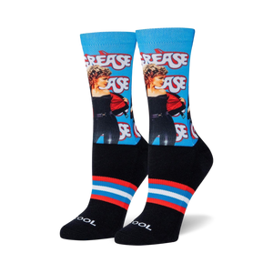 black socks with blue and red striped cuff and heel. crew length. female. grease movie themed repeating pattern.  