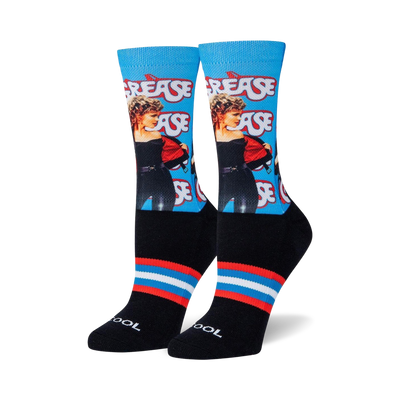 black socks with blue and red striped cuff and heel. crew length. female. grease movie themed repeating pattern.  