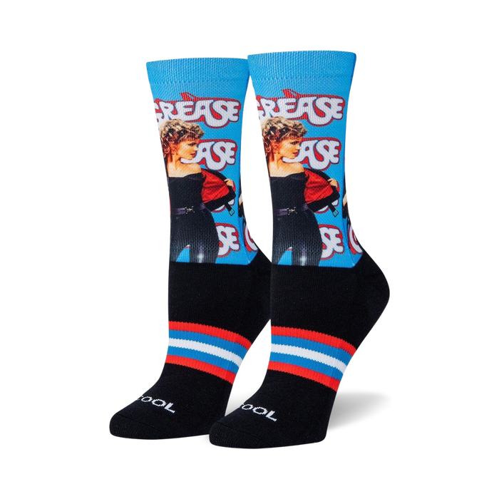 black socks with blue and red striped cuff and heel. crew length. female. grease movie themed repeating pattern.  