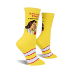 Lifestyle shot of a woman's legs wearing the IDGAS yellow crew socks. The socks are prominently displayed.